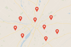 Carte de ville avec des marqueurs de position pour illustrer le suivi du référencement local par zone géographique